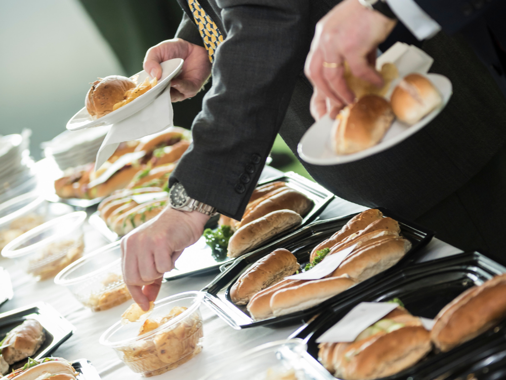 Business people picking up sandwiches at Fixby Hall